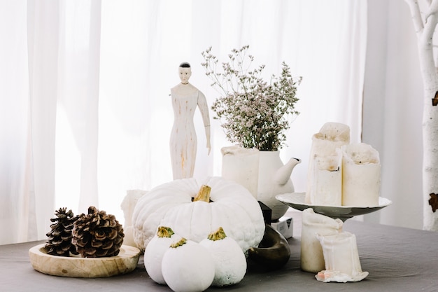 Free Photo decor with pumpkins and figurine