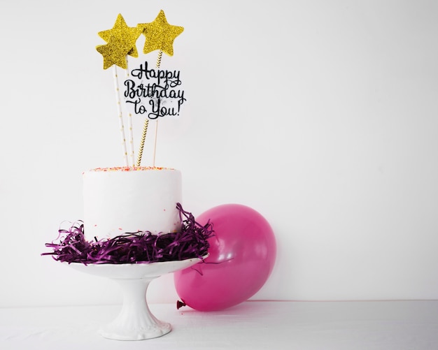 Free photo decorated cake and balloon