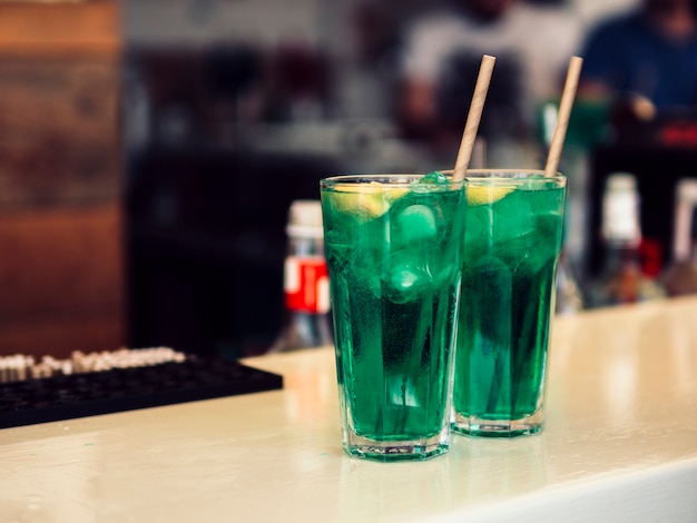 Free photo decorated glasses of colourful green beverage