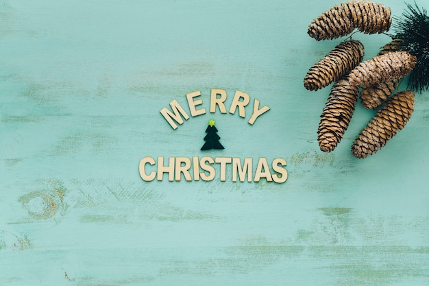 Free photo decoration for christmas with letters and pine cones