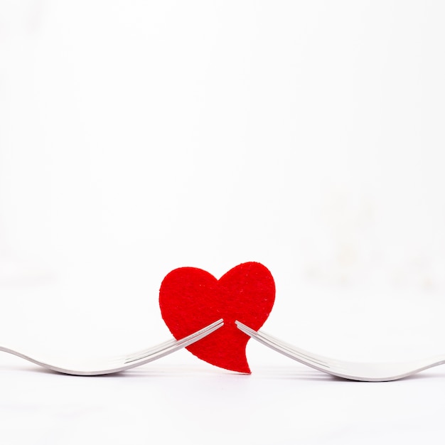 Free Photo decoration with forks holding a red heart