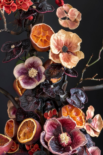 Decorative arrangement with dried fruits and flowers