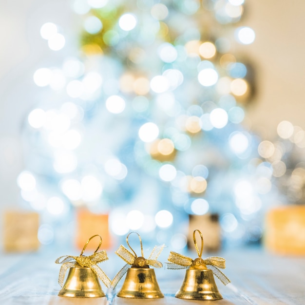 Decorative bells near Christmas tree