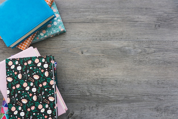 Decorative books on wooden surface