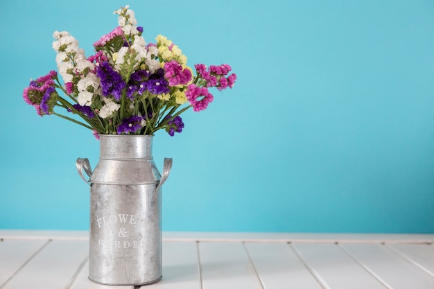 Decorative bouquet on metallic vase