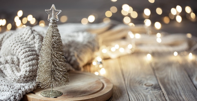 Decorative christmas tree on blurred background with bokeh