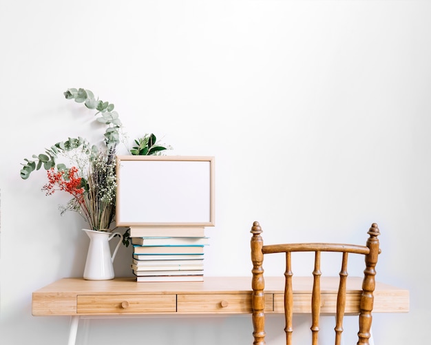 Free photo decorative desk with books and plant