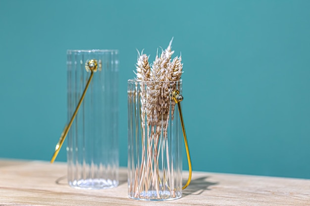 Decorative glass jars for storage on a blue background