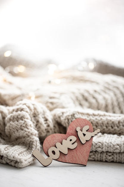 Free Photo a decorative heart among cozy knitted items valentines day holiday concept