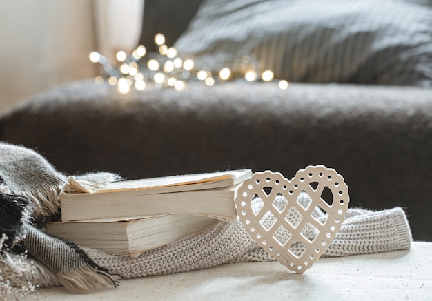 Free photo decorative heart and a stack of books.