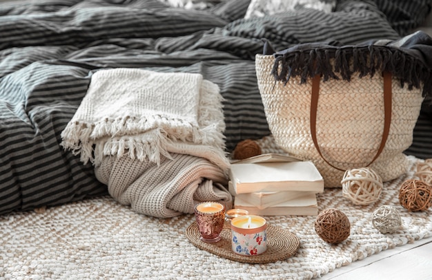 Free photo decorative items in a cozy home interior. wicker straw large bag, and decorative elements.