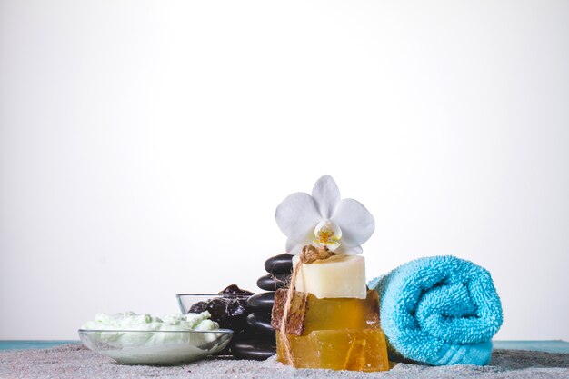 Decorative spa objects on grey towel