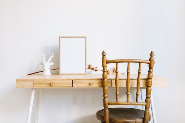 Decorative table with frame and branch