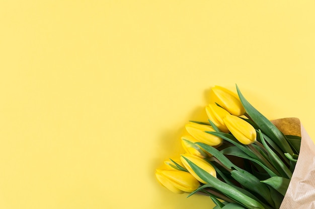 Decorative tulips on yellow background