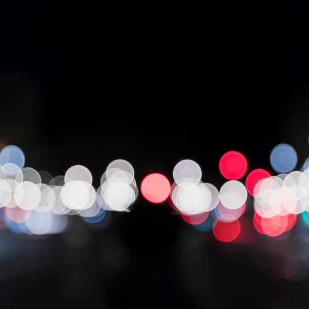 Free photo defocused bokeh of colorful lights at night