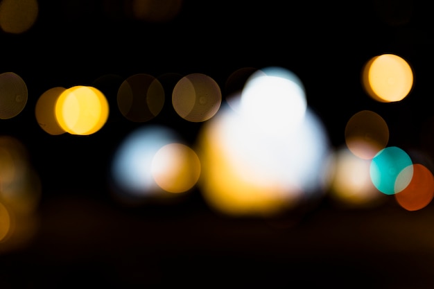 Free photo defocused bokeh light against black background