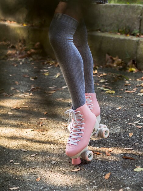 Defocused woman wearing socks and roller skates