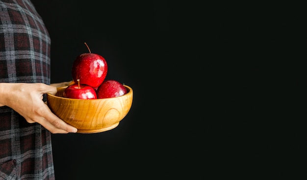 Free photo delicious apples being held by person