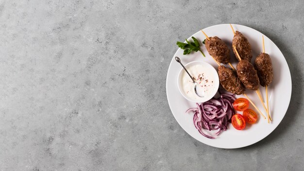 Delicious arabic fast-food skewers on plate