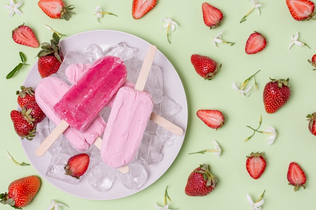 Delicious arrangement of summer ice cream and slices of strawberries