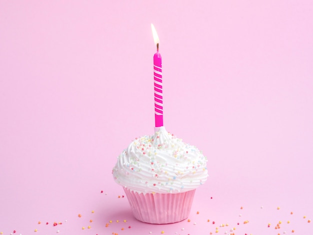 Free photo delicious birthday muffin with pink candle