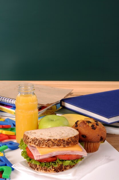 Delicious breakfast next to some textbooks