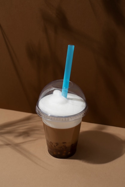 Free photo delicious bubble tea cup with straw