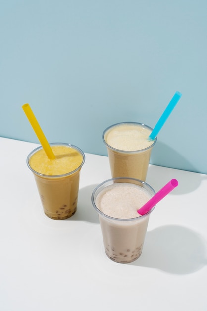 Free photo delicious bubble tea drinks with milk high angle