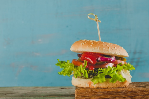 Delicious burger with lettuce and tomato