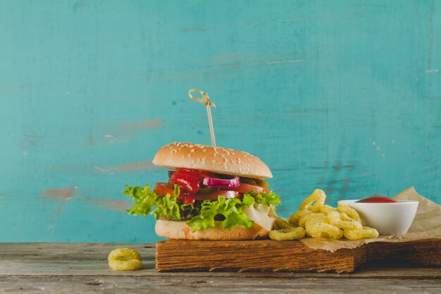 Delicious burger with onion rings