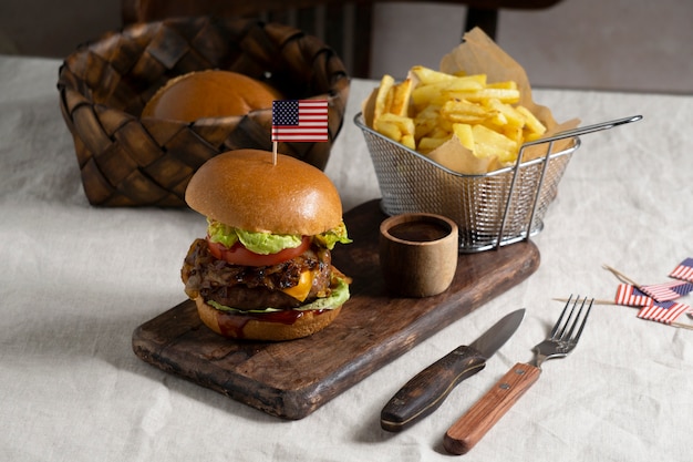 Delicious burger with usa flag and fries  high angle