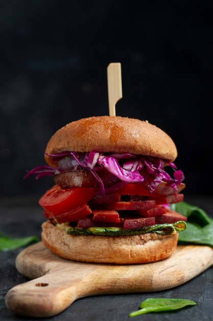 Delicious burger on wooden board