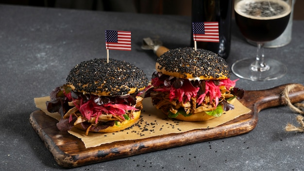 Delicious burgers on wooden board