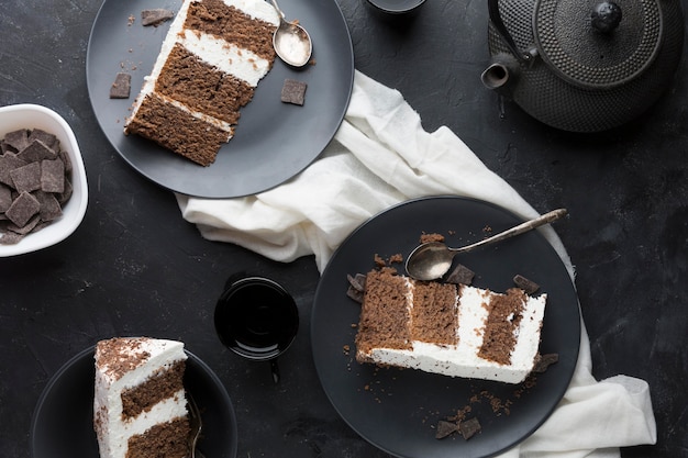 Delicious cake on black plate top view