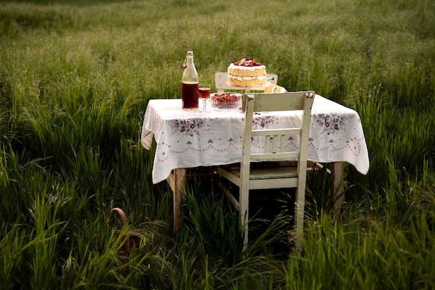 Free photo delicious cake and drink on table outdoors