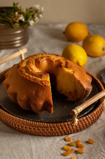 Delicious cake and lemons high angle