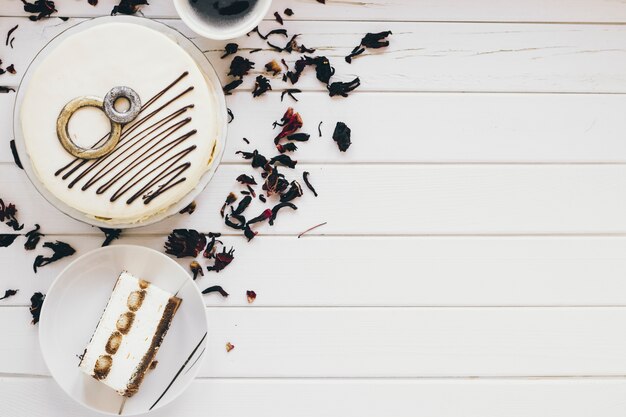 Delicious cake and tea leaves