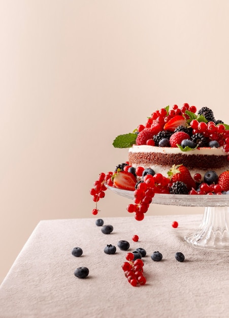 Free Photo delicious cake with forest fruits composition