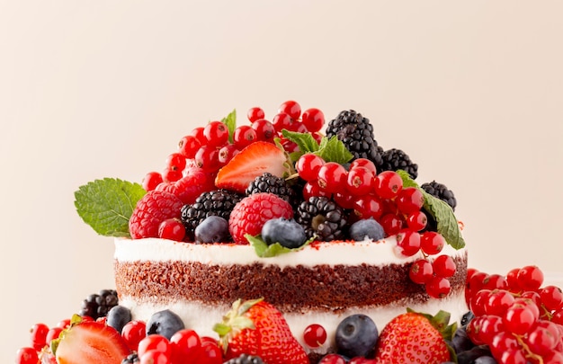 Free photo delicious cake with forest fruits composition