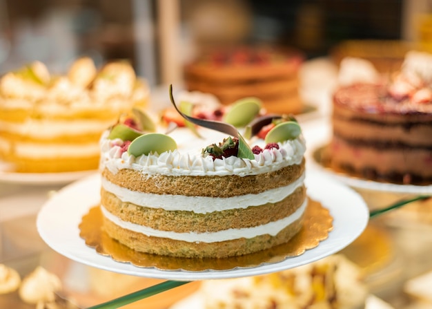 Delicious cake with fruits and cream