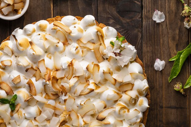 Delicious cake on wooden table flat lay