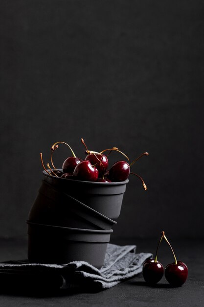 Delicious cherries in bowl front view