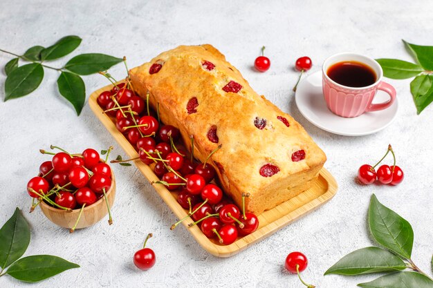 Delicious cherry cake with fresh cherries, top view