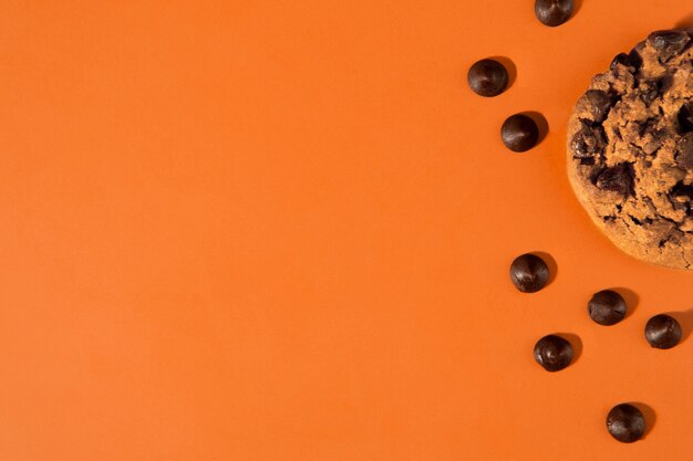 Delicious chocolate chips with copy space above view