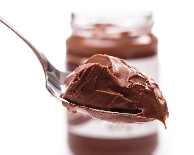 Free photo delicious chocolate cream on a spoon