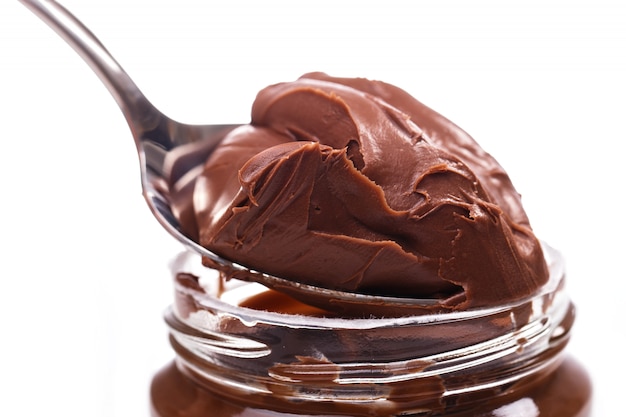 Free photo delicious chocolate cream on a spoon