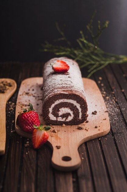 Delicious chocolate roll in powdered sugar