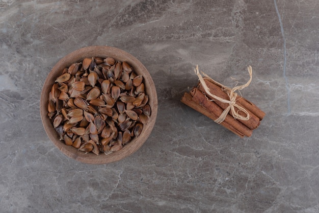 Free Photo delicious cinnamon and seeds on the marble surface