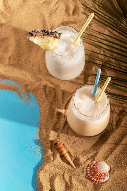 Free photo delicious cocktails on beach arrangement