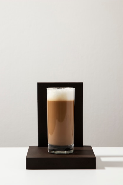 Free Photo delicious coffee with foam on wooden board